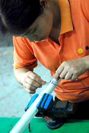 Deng hand stitching a water ski handle