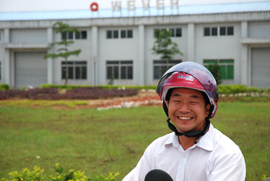 Tang riding on the scooter